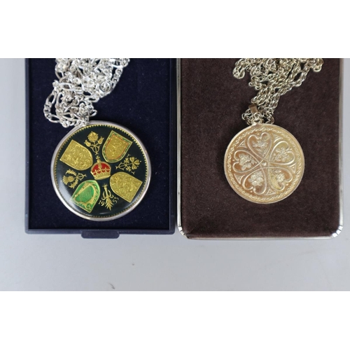 81 - 2 silver commemorative medals on chains together with another medal