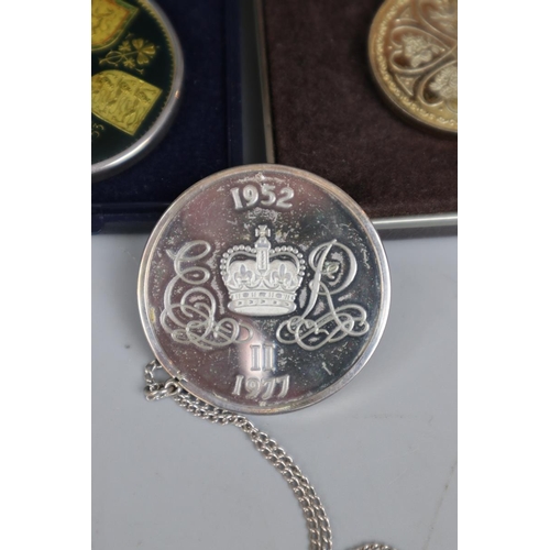 81 - 2 silver commemorative medals on chains together with another medal