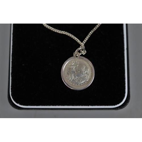 82 - Britannia silver pendant on chain with COA together with white metal Queen Elizabeth II commemorativ... 