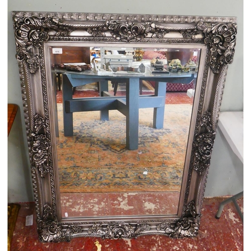 416 - Ornate framed bevelled glass mirror