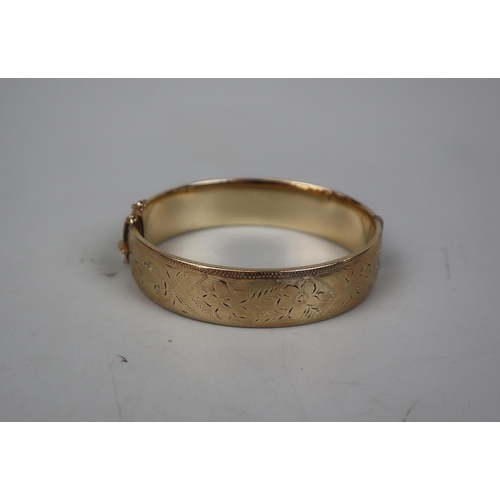 66 - 9ct gold metal core bangle