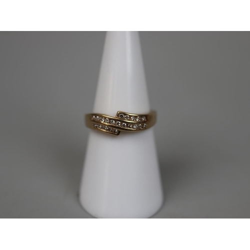 71 - 9ct gold channel diamond set ring - Size M½