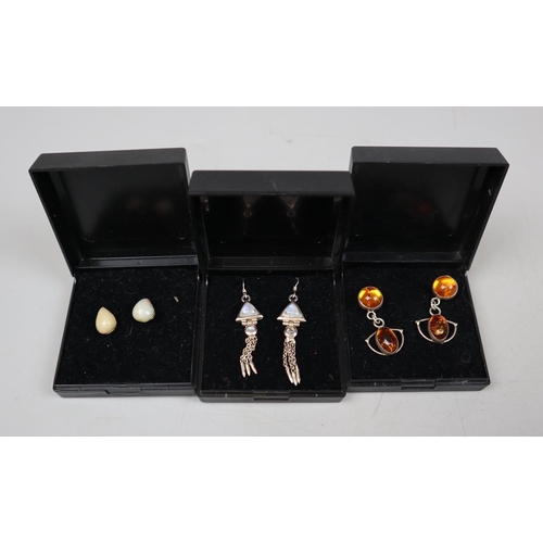 83 - Collection of moonstone, opal and amber earrings on silver