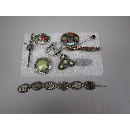 103 - Selection of 9 Scottish brooches together with a Scottish bracelet