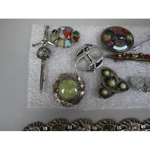 103 - Selection of 9 Scottish brooches together with a Scottish bracelet