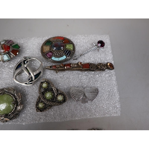 103 - Selection of 9 Scottish brooches together with a Scottish bracelet