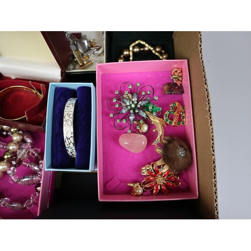 104 - Large collection of costume jewellery to include brooches, watches etc