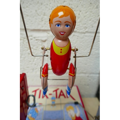 447 - Tik-Tak acrobat tin plate trapeze 