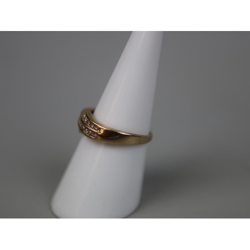 71 - 9ct gold channel diamond set ring - Size M½