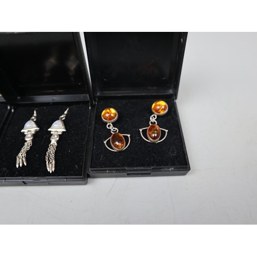 83 - Collection of moonstone, opal and amber earrings on silver
