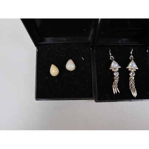 83 - Collection of moonstone, opal and amber earrings on silver