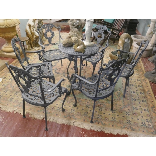 331 - Cast iron table with 6 chairs