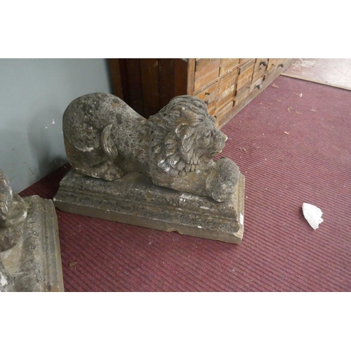 370 - Pair of stone lions with ball