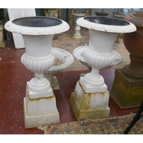 451 - Pair of cast iron planters on plinths - Approx height: 110cm