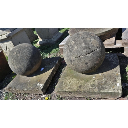 69 - Pair of stone orb finials