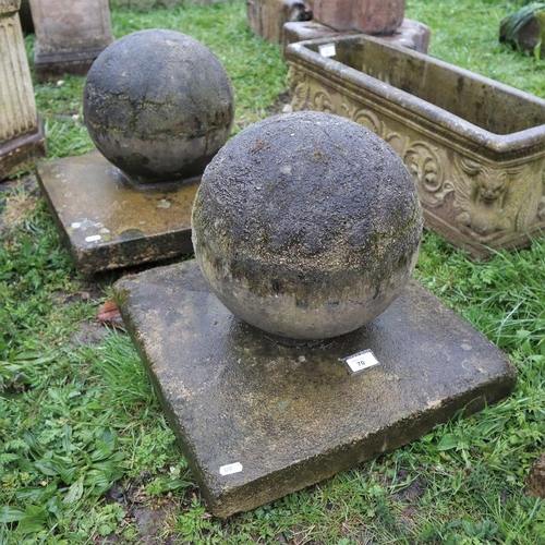 70 - Pair of stone orb finials