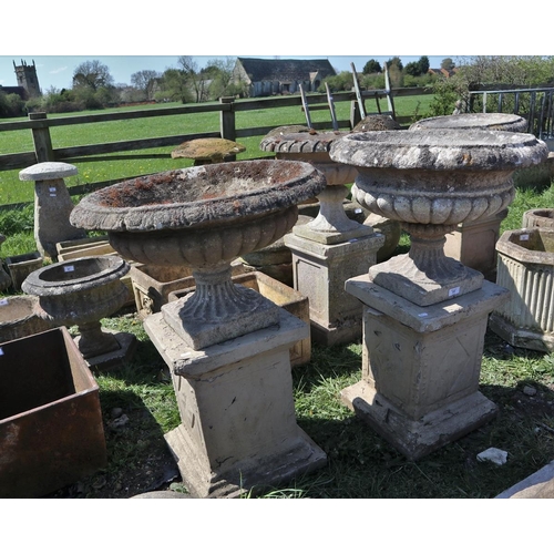 77 - Pair of stone planters on plinths - Approx height: 89cm