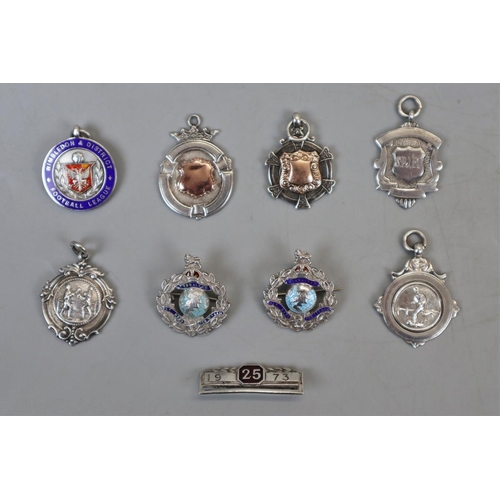 21 - Collection of gold & silver fobs and badges