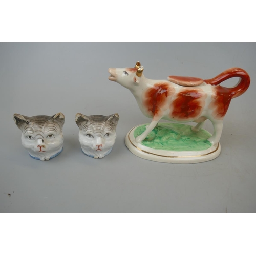 226 - 2 Victorian cat head money boxes and Staffordshire cow creamer