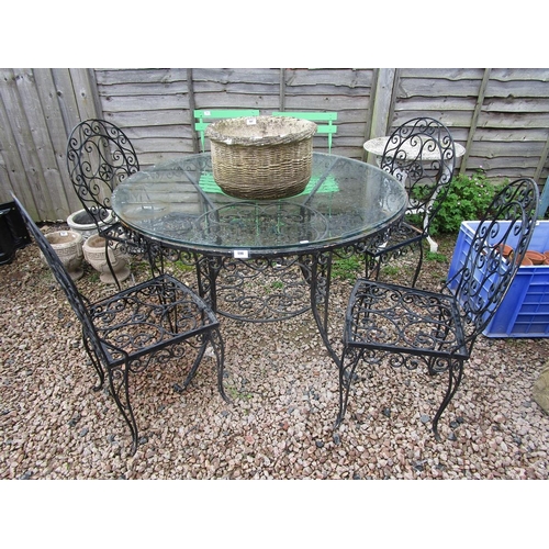 598 - Wrought iron circular garden table with 4 chairs