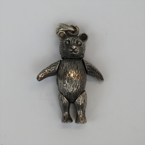 62 - Silver articulated teddy bear pendent