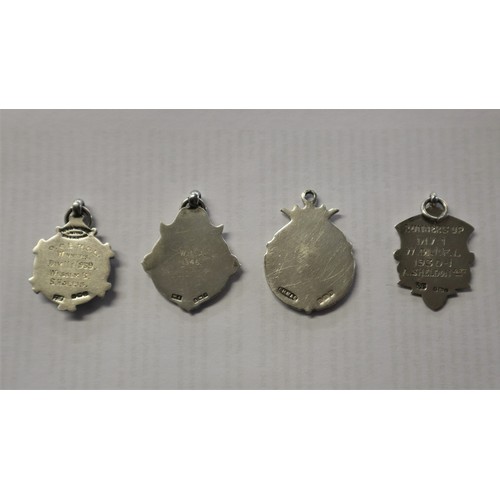 21 - Collection of gold & silver fobs and badges