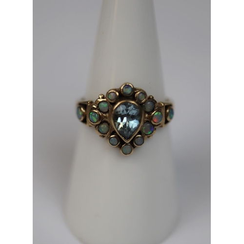 43 - 9ct gold ring set with aquamarine & opals - Size N