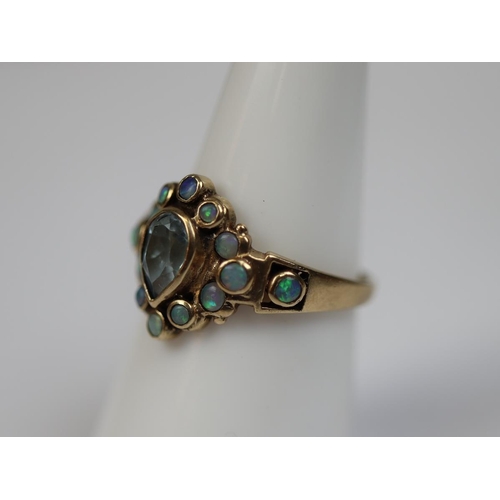 43 - 9ct gold ring set with aquamarine & opals - Size N