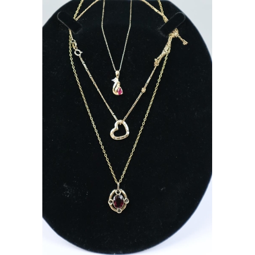 53 - 3 x 9ct gold stone set pendants on chains