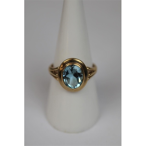 67 - 9ct gold blue topaz set ring - Size O