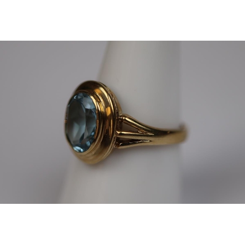 67 - 9ct gold blue topaz set ring - Size O