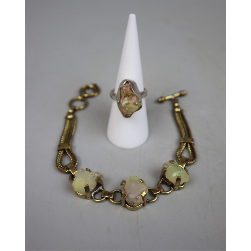 77 - Silver ring set with rough opal together with rough opal gold tone bracelet