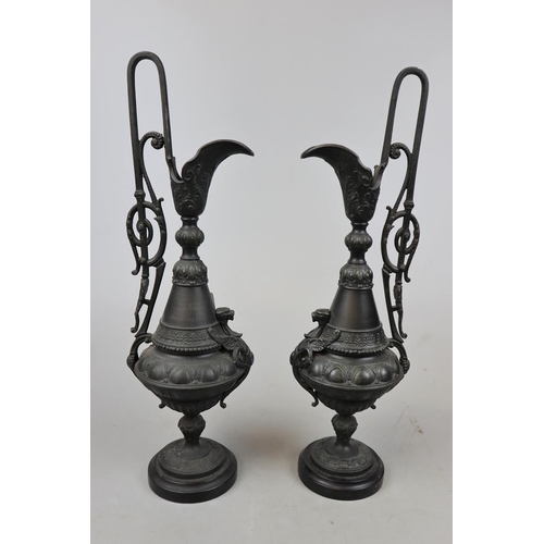 190 - Pair of metal candlesticks in form of claret jugs - Approx height: 43cm