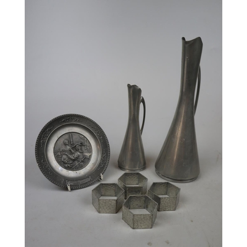 191 - Graduated pair of Norwegian Modernist pewter jugs together with a pewter plate and 4 pewter napkin r... 