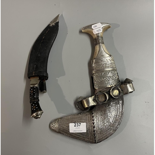 237 - Arabic Jambiya dagger with white metal scabbard together with another dagger