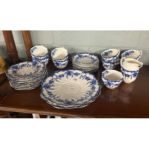 259 - Diamond china tea set to include 9 cups, 11 saucers, 1 milk jug, 10 plates and 2 sandwich/cake plate... 