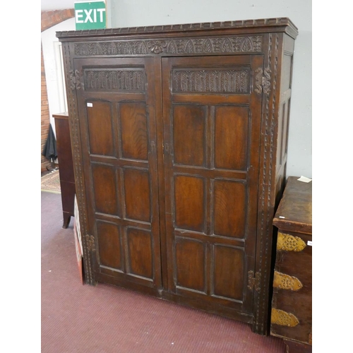 419 - Carved oak wardrobe - Approx size W: 140cm D: 62cm H: 183cm