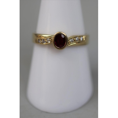 69 - 18ct gold ruby & diamond set ring - Size P