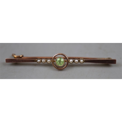 72 - 9ct gold peridot & peal bar brooch