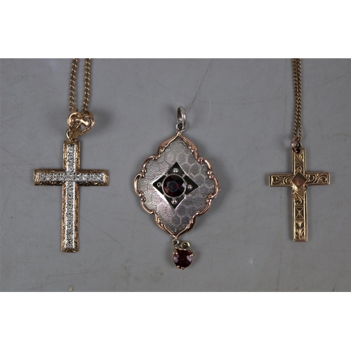 75 - 2 9ct gold crucifix and chains together with silver and garnet pendant approx gross weight of gold 8... 