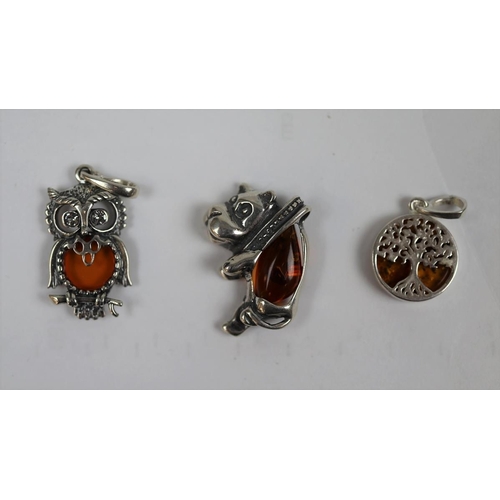 86 - 3 silver & amber pendants