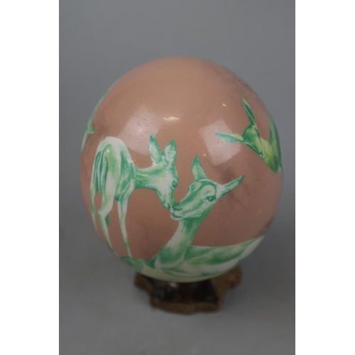 179 - 2 ostrich eggs hand decorated and signed Shelly Rowe - Approx height: 21cm