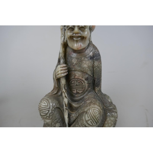 223 - Chinese carved soapstone figure of a Lohan seated holding a dragon - late Qing early republic - Appr... 