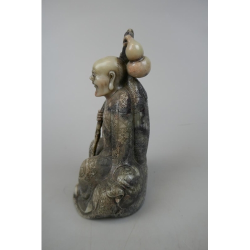 223 - Chinese carved soapstone figure of a Lohan seated holding a dragon - late Qing early republic - Appr... 