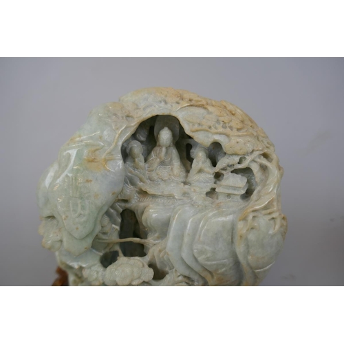 228 - Antique carved jade boulder with scholars on a bridge in a cavernous landscape to one side and Buddh... 