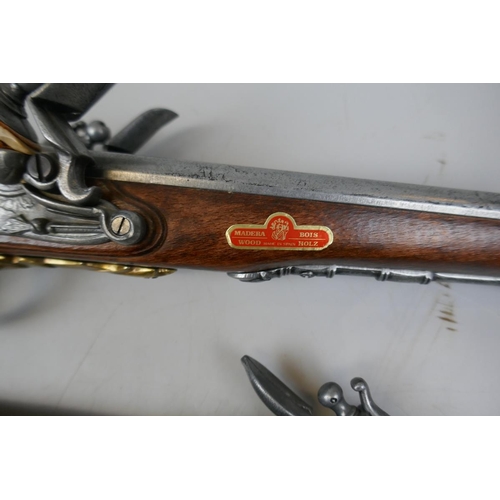 233 - 2 reproduction flintlock pistols