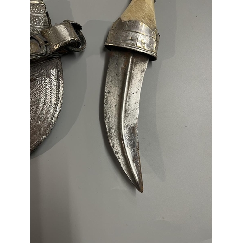 237 - Arabic Jambiya dagger with white metal scabbard together with another dagger