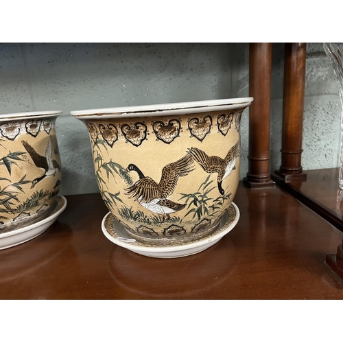 254 - Pair of glazed planters adorned with birds together with an oriental planter