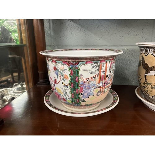 254 - Pair of glazed planters adorned with birds together with an oriental planter