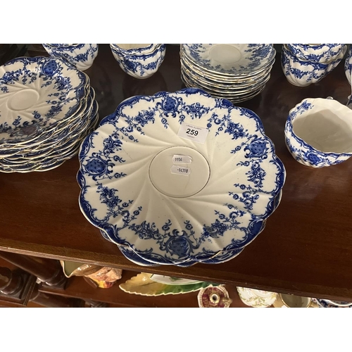 259 - Diamond china tea set to include 9 cups, 11 saucers, 1 milk jug, 10 plates and 2 sandwich/cake plate... 